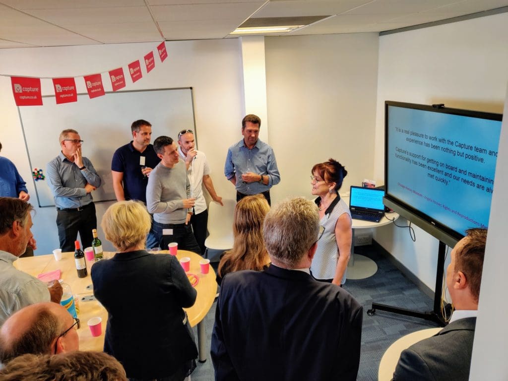 Capture DAM's team celebrating their new office in Reading area.